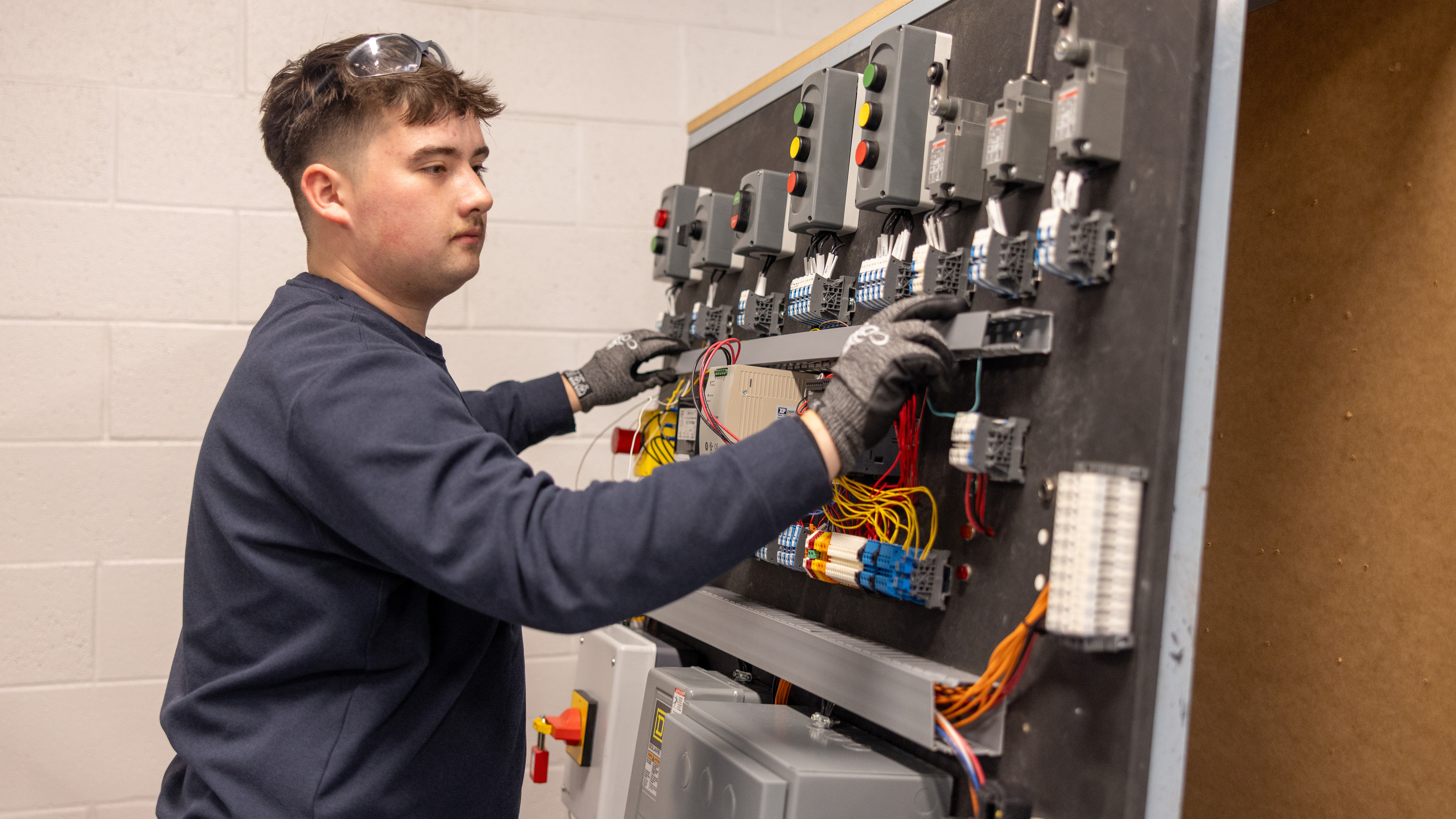 Wake Tech students training in the electrical systems program