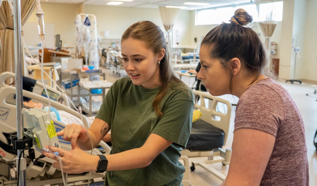 A Wake Tech health sciences student receiving clinical instruction
